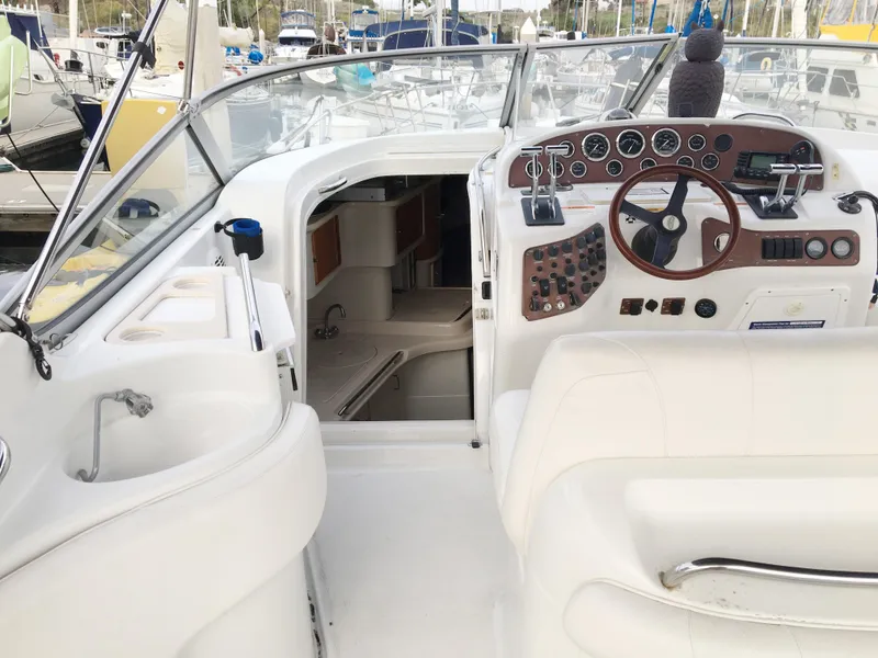 Slide: The Image of Interior of a 1999 Chris-Craft 320 Express Cruiser with helm station. - 17
