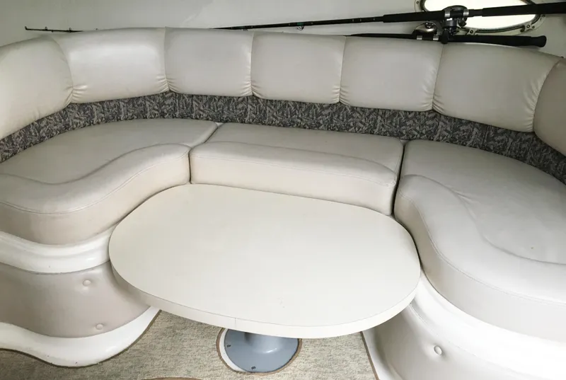 Slide: The Image of Interior of 1999 Chris-Craft 320 Express Cruiser with beige sofa. - 19