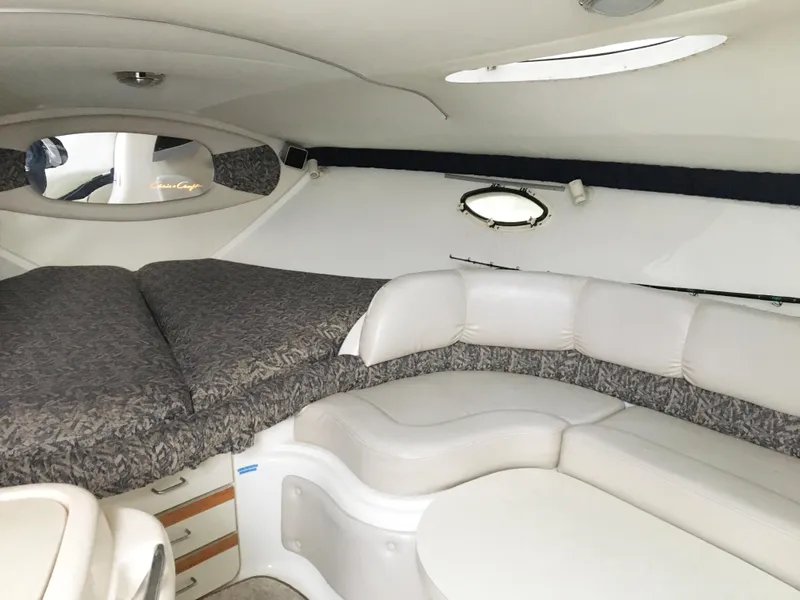 Slide: The Image of Interior of 1999 Chris-Craft 320 Express Cruiser with cozy seating area. - 20