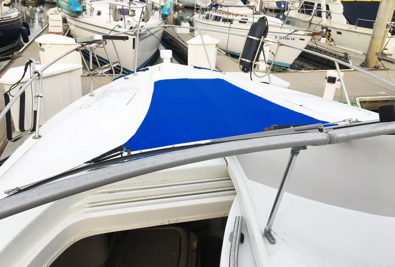 Slide: The Image of 1999 Chris-Craft 320 Express Cruiser docked, front deck view. - 3