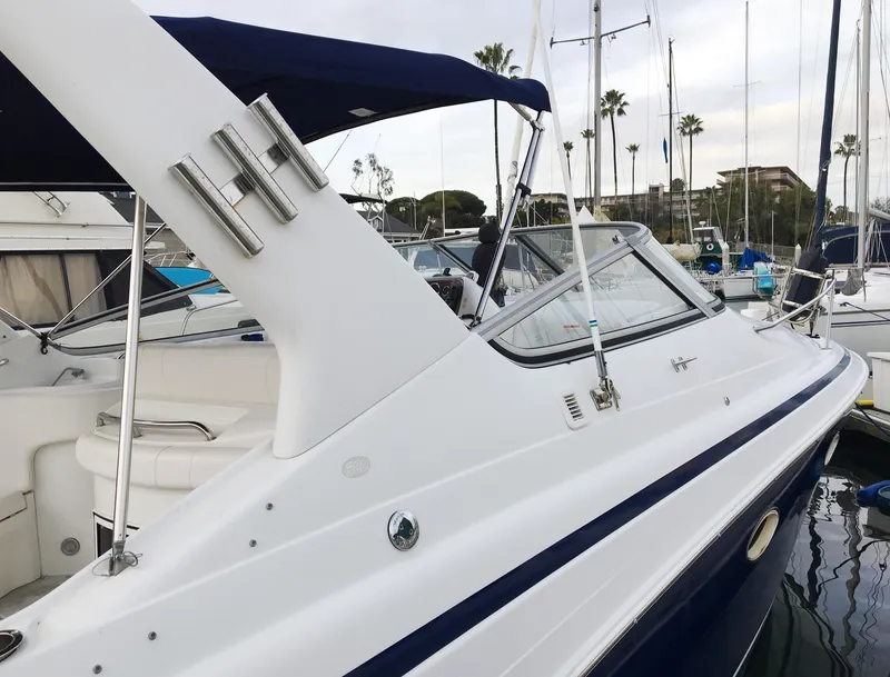Slide: The Image of 1999 Chris-Craft 320 Express Cruiser docked, side view. - 5