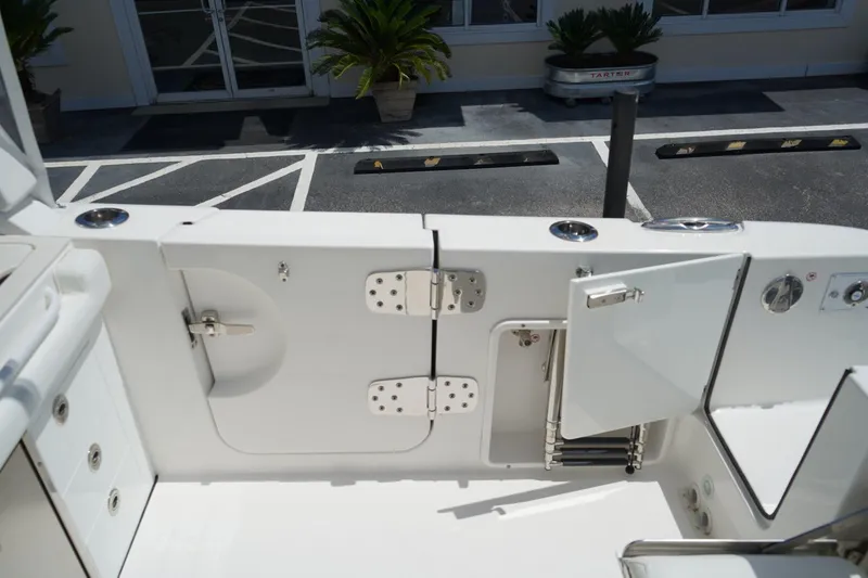 Slide: The Image of 2020 Edgewater 262CX Crossover boat with open transom door and ladder. - 11