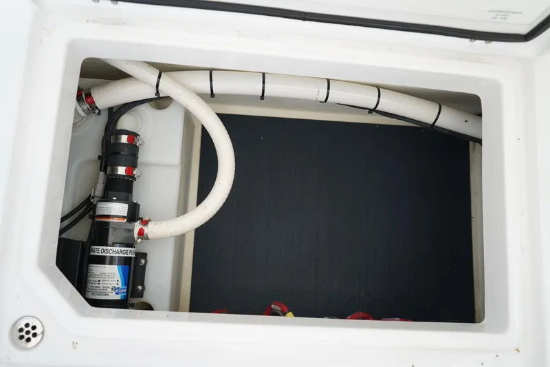 Slide: The Image of Waste discharge pump in 2020 Edgewater 262CX Crossover boat compartment. - 22