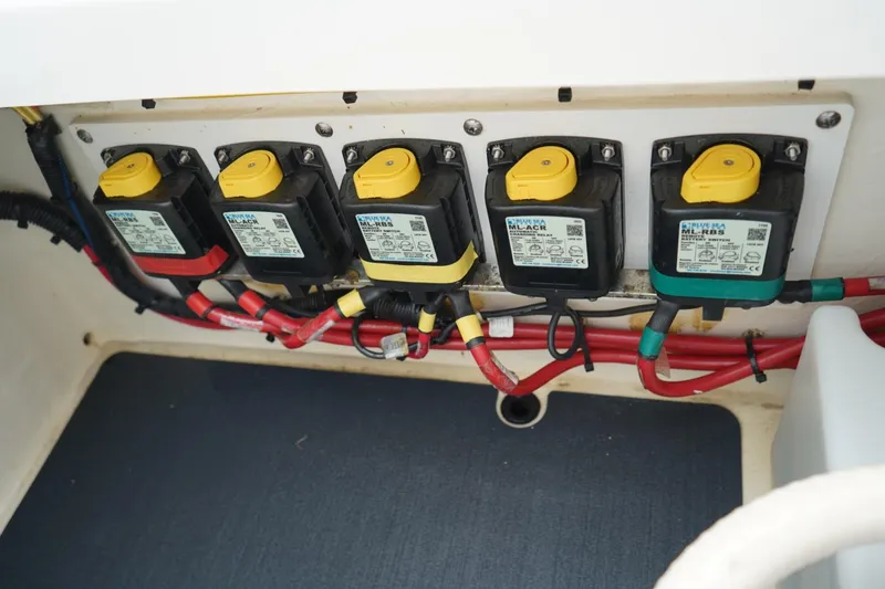 Slide: The Image of Electrical panel with switches and wiring on a 2020 Edgewater 262CX Crossover boat. - 23