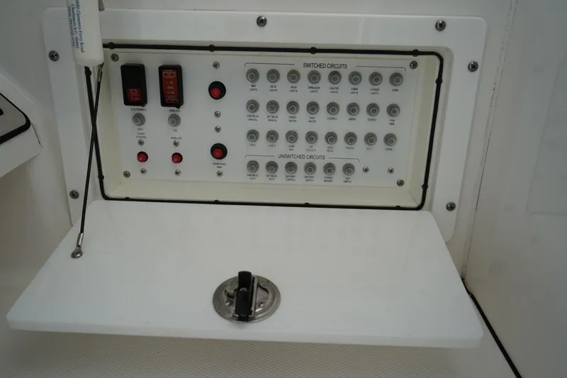 Slide: The Image of Electrical control panel on a 2020 Edgewater 262CX Crossover boat. - 24