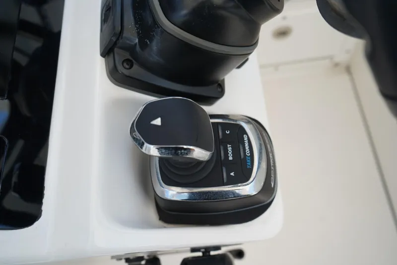 Slide: The Image of Close-up of 2020 Edgewater 262CX Crossover boat control joystick. - 27