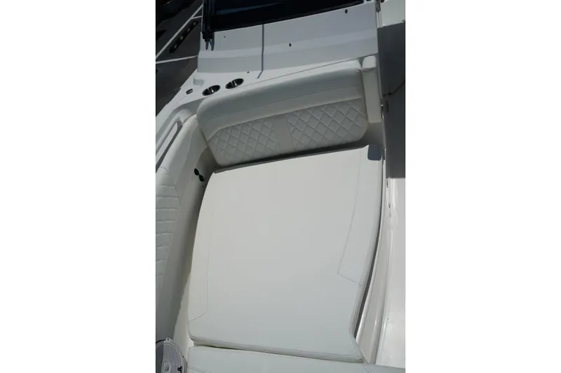 Slide: The Image of Interior seating of 2020 Edgewater 262CX Crossover boat with quilted upholstery. - 37