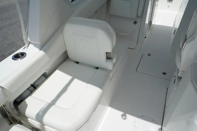 The Image of Interior view of 2020 Edgewater 262CX Crossover boat with white seating and sleek design. - 9