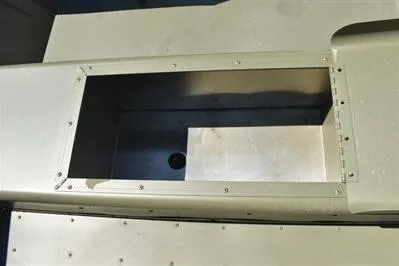 Slide: The Image of 2025 Lowe L1652MT Jon boat compartment, open storage area with metal finish. - 12