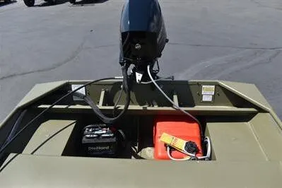 Slide: The Image of 2025 Lowe L1652MT Jon boat with motor, battery, and fuel tank on deck. - 13