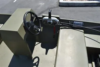 Slide: The Image of 2025 Lowe L1652MT Jon boat interior with steering wheel and control panel. - 14