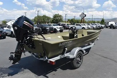 Slide: The Image of 2025 Lowe L1652MT Jon boat with Mercury motor on trailer in parking lot. - 7