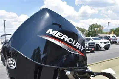 Slide: The Image of 2025 Lowe L1652MT Jon boat with Mercury outboard motor in a parking lot. - 9
