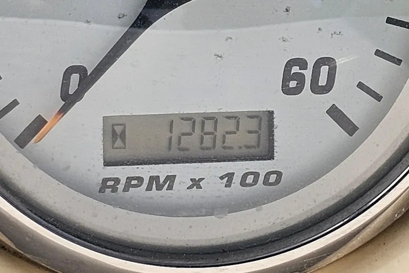 Slide: The Image of Close-up of Larson Cabrio 330 tachometer showing 1282.3 RPM reading. - 26