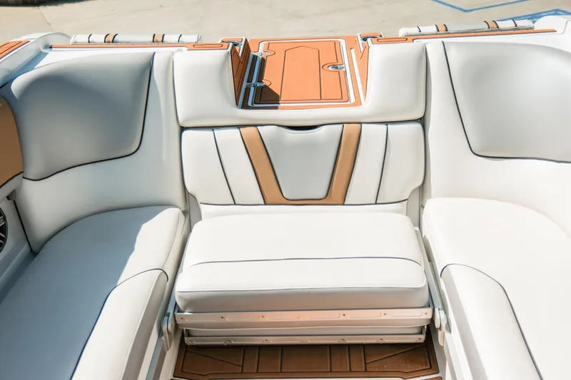 Slide: The Image of 2021 MB F24 Tomcat Alpha boat interior with white and tan seating. - 22
