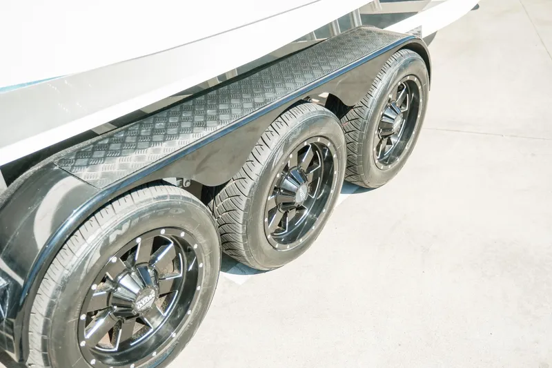 Slide: The Image of Triple axle trailer with black wheels for 2021 MB F24 Tomcat Alpha boat. - 28