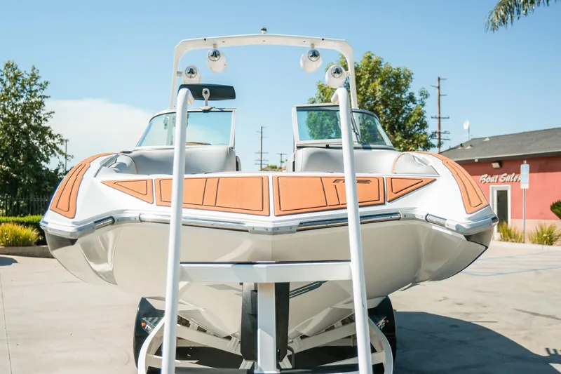 Slide: The Image of 2021 MB F24 Tomcat Alpha boat displayed outdoors on a sunny day. - 30