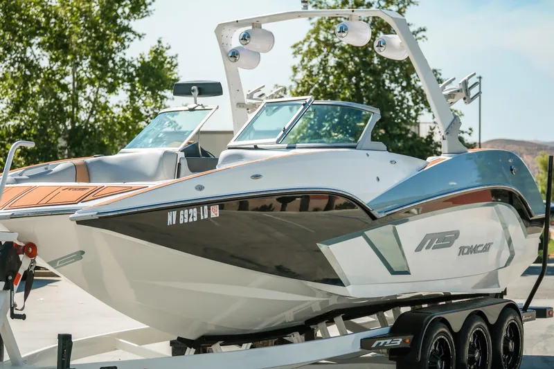 Slide: The Image of 2021 MB F24 Tomcat Alpha boat on trailer, parked outdoors. - 9