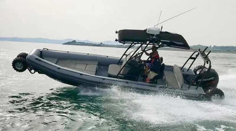 Slide: The Image of 2022 Ocean Craft Marine 8.4 M Amphibious boat cruising on water. - 0