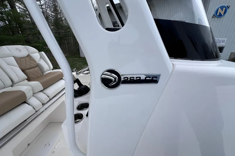 Slide: The Image of 2022 Edgewater 262CC boat interior with logo and seating detail. - 15