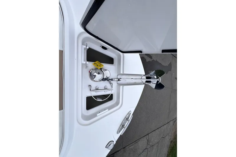 Slide: The Image of Anchor compartment of 2022 Edgewater 262CC boat, featuring stainless steel hardware. - 17