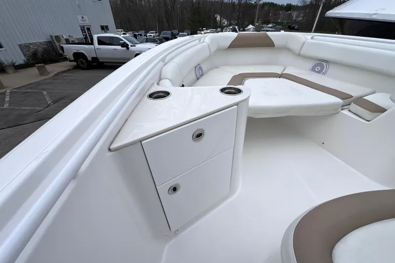 Slide: The Image of 2022 Edgewater 262CC boat interior with seating and storage compartments. - 27