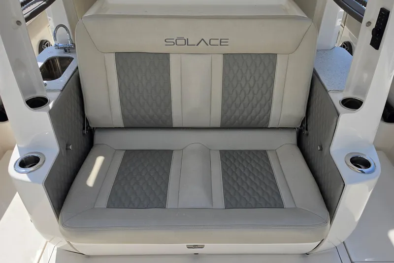 Slide: The Image of Luxurious seating on 2025 Solace 37CS boat, featuring elegant gray upholstery and integrated cup holders. - 10