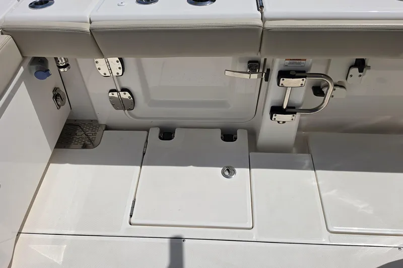 Slide: The Image of Interior view of 2025 Solace 37CS boat, featuring storage compartments and seating. - 14