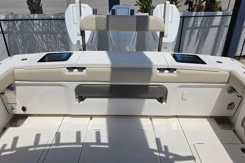 Slide: The Image of 2025 Solace 37CS boat deck with seating and storage compartments. - 16