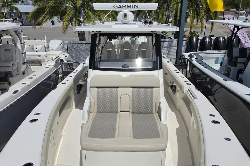 Slide: The Image of 2025 Solace 37CS boat with Garmin equipment, featuring sleek seating and modern design. - 23
