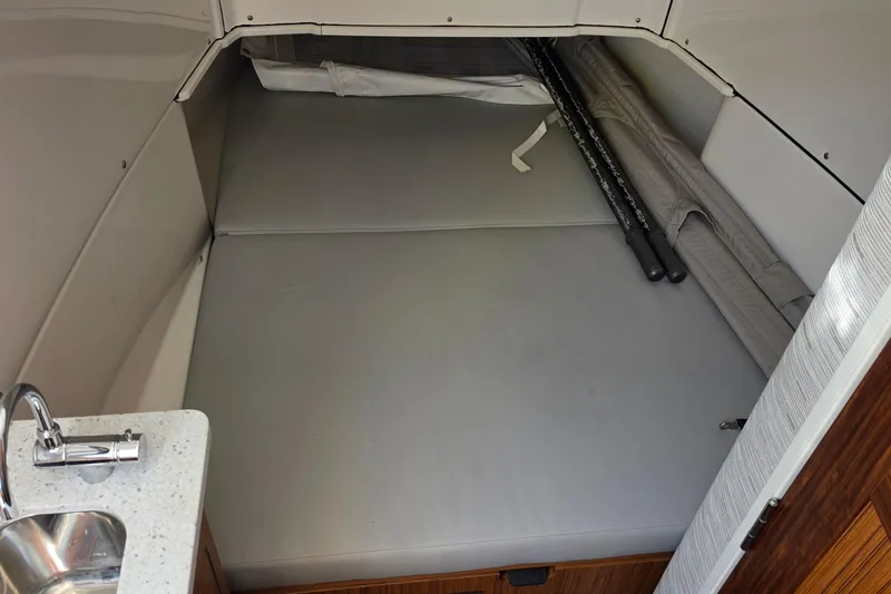 Slide: The Image of Interior cabin of 2025 Solace 37CS boat with bed and sink. - 28