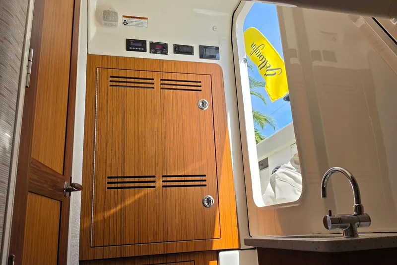 Slide: The Image of Interior of 2025 Solace 37CS boat with wooden cabinetry and modern fixtures. - 29