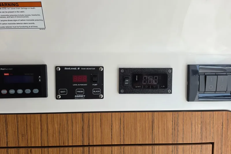 Slide: The Image of Control panel of 2025 Solace 37CS with tank monitor and switches. - 30