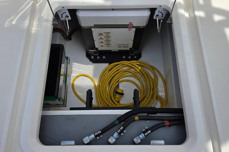 Slide: The Image of Engine compartment of 2025 Solace 37CS boat with cables and equipment. - 31