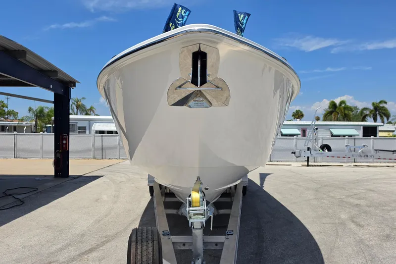 Slide: The Image of 2025 Solace 37CS boat on trailer, front view, under clear blue sky. - 8