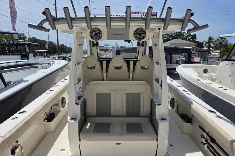 Slide: The Image of 2025 Solace 37CS boat interior with seating and rod holders, showcasing luxury and functionality. - 9