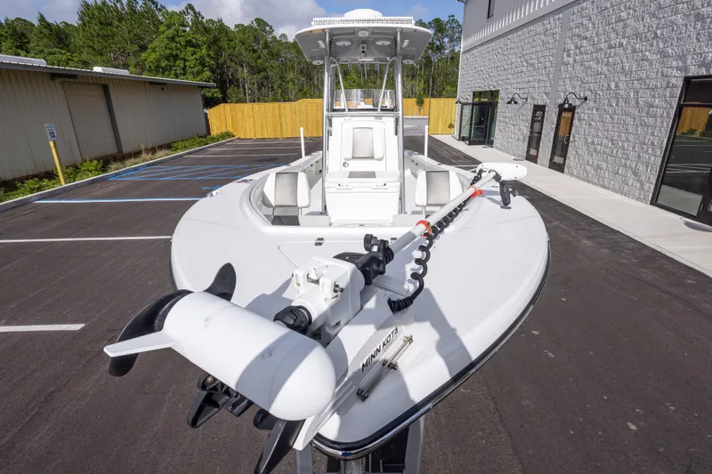 Slide: The Image of 2022 BlackJack 256 Coastal boat with Minn Kota trolling motor in parking lot. - 11
