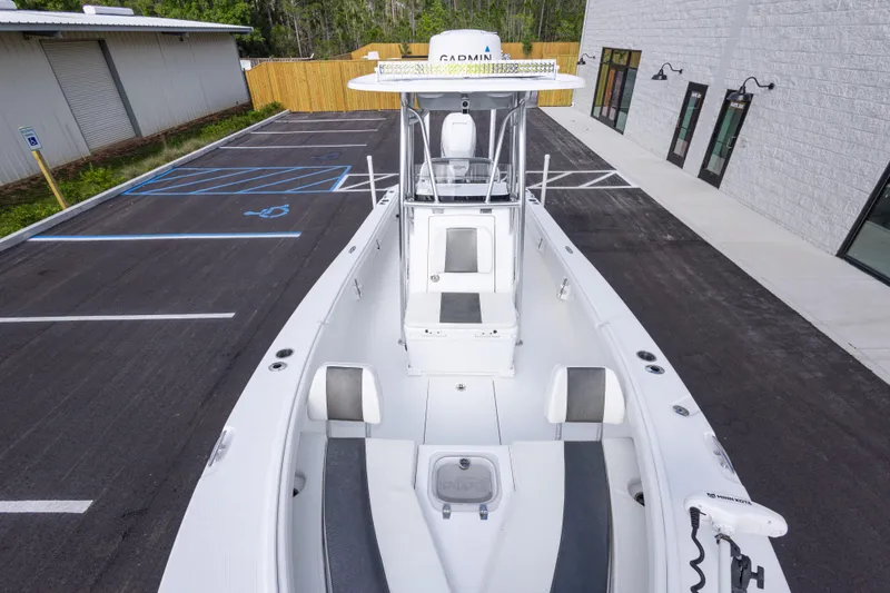 Slide: The Image of 2022 BlackJack 256 Coastal boat in parking lot, showcasing sleek design and spacious deck. - 27
