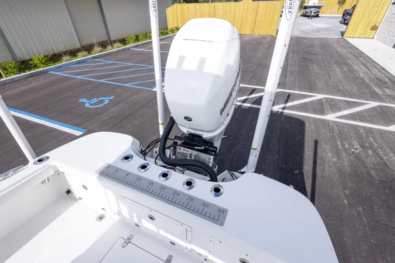 Slide: The Image of 2022 BlackJack 256 Coastal boat with Mercury engine in parking lot. - 32