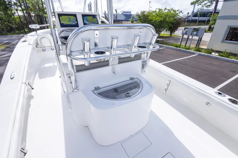 Slide: The Image of 2022 BlackJack 256 Coastal boat interior with navigation screens and rod holders. - 33