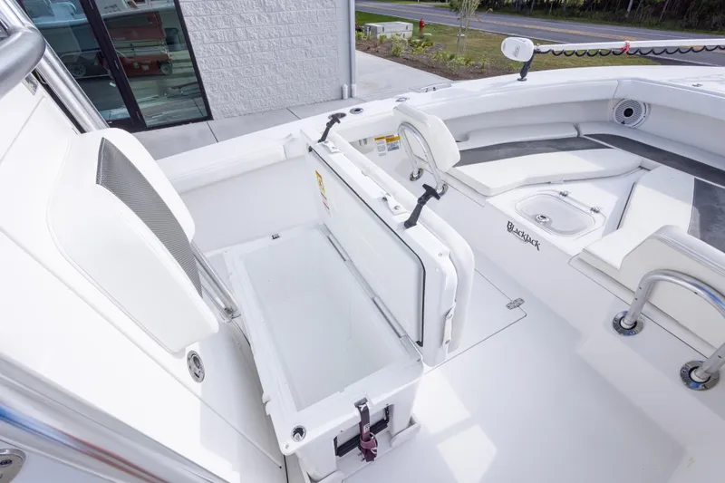 Slide: The Image of 2022 BlackJack 256 Coastal boat interior with seating and storage compartments. - 35