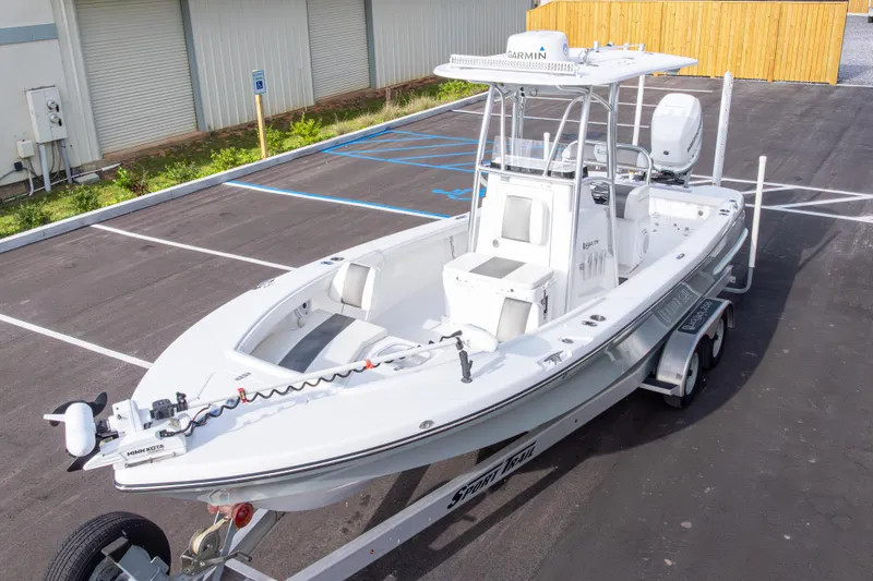 Slide: The Image of 2022 BlackJack 256 Coastal boat on trailer in parking lot, featuring Garmin equipment. - 46