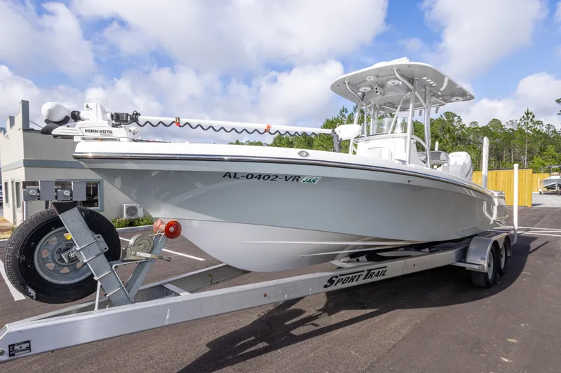 Slide: The Image of 2022 BlackJack 256 Coastal boat on trailer, parked outdoors under a cloudy sky. - 9