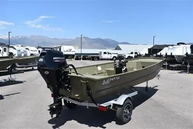 Slide: The Image of 2025 Lowe L1648M Jon boat with Mercury engine on trailer, parked outdoors. - 3