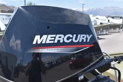 Slide: The Image of Mercury outboard motor on 2025 Lowe L1648M Jon boat, outdoor setting. - 6