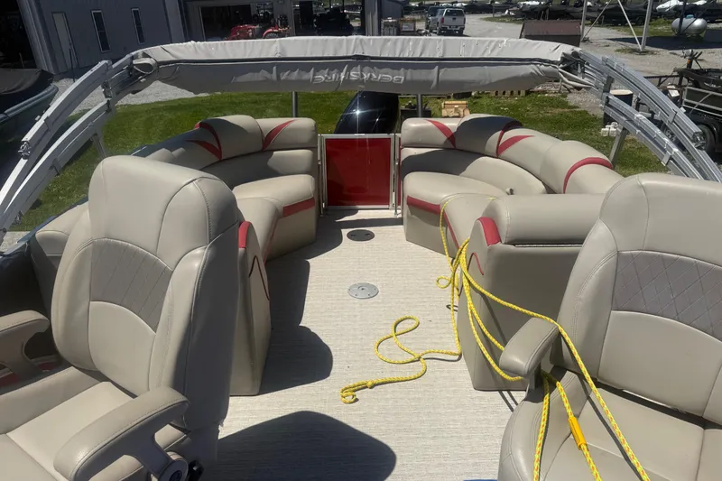 Slide: The Image of 2019 Berkshire 23RFX STS pontoon boat interior with beige seating and yellow rope. - 10