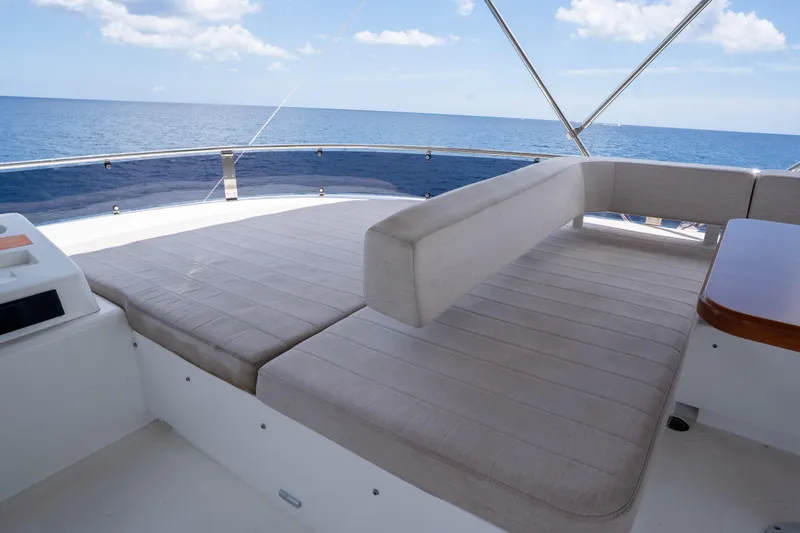 Slide: The Image of Luxurious seating area on 2025 Sirena 58 yacht with ocean view. - 12