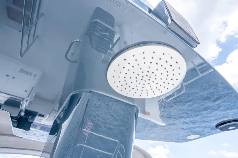 Slide: The Image of Outdoor shower on Sirena 58 yacht, 2025 model, reflecting sky and water. - 15