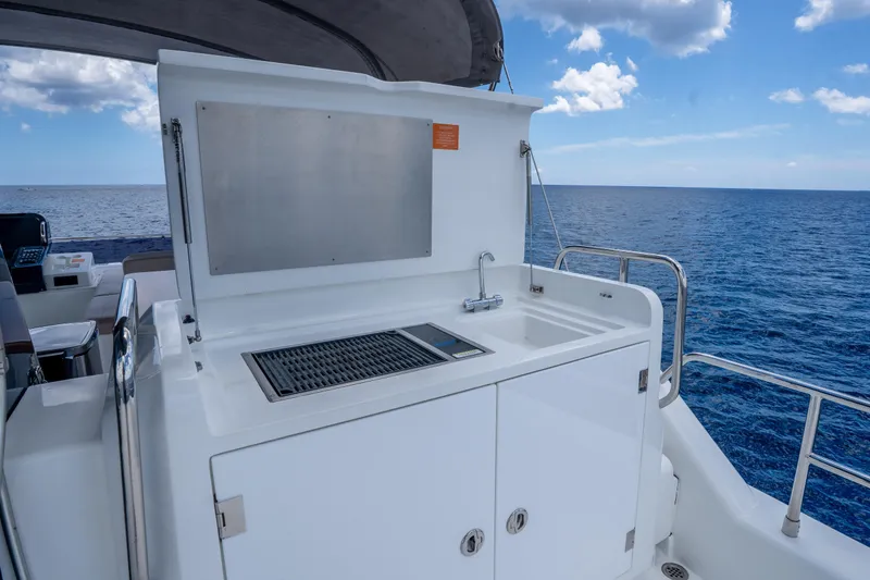 Slide: The Image of Outdoor kitchen on 2025 Sirena 58 yacht with ocean view. - 16