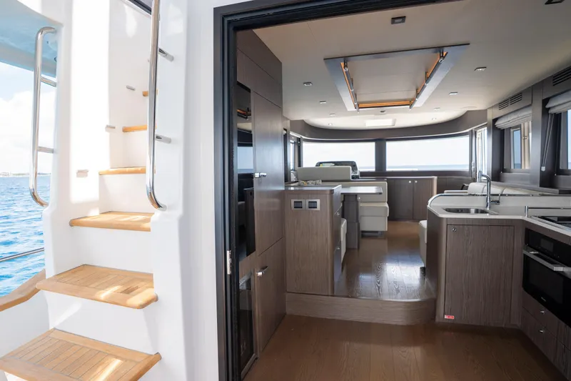 Slide: The Image of Luxurious interior of 2025 Sirena 58 yacht with modern kitchen and elegant design. - 31